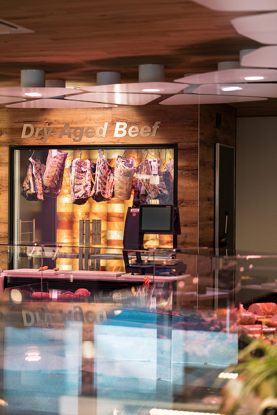 The Aging Room. Premium Meat Dry-Aging Walk-in Chamber with a Wall of Pink Himalayan Salt in Walnut Cover.